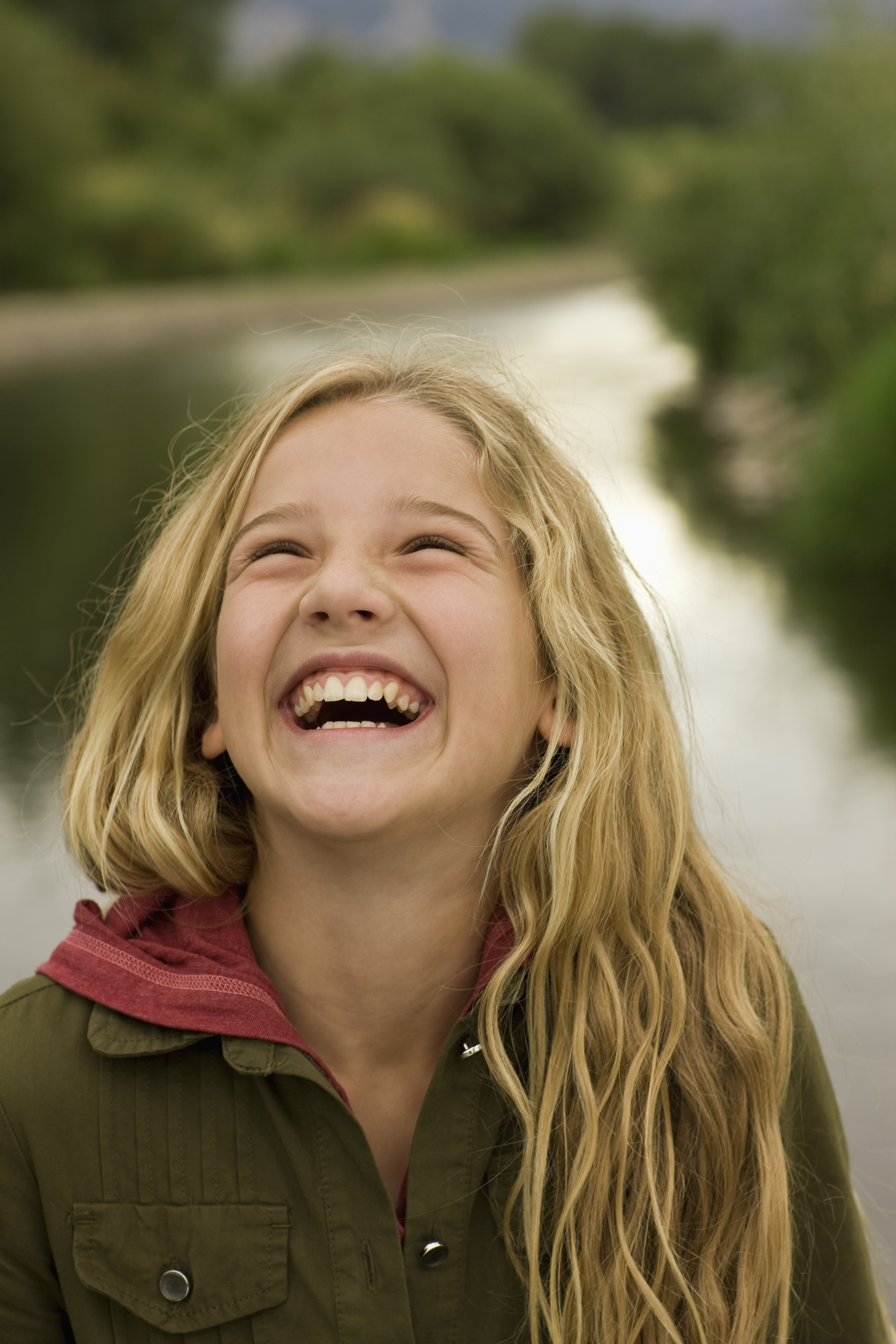 Portrait of girl laughing outside - Lynn B. Davies LLC Psychotherapist.